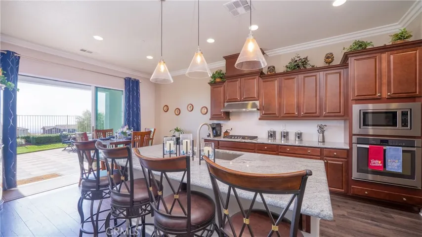 Kitchen With Center Island, Panoramic Door To Backyard Views