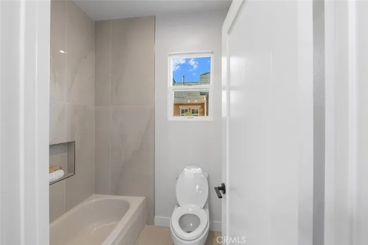 Bedrooms 2 and 3 share a spacious bathroom on the second floor