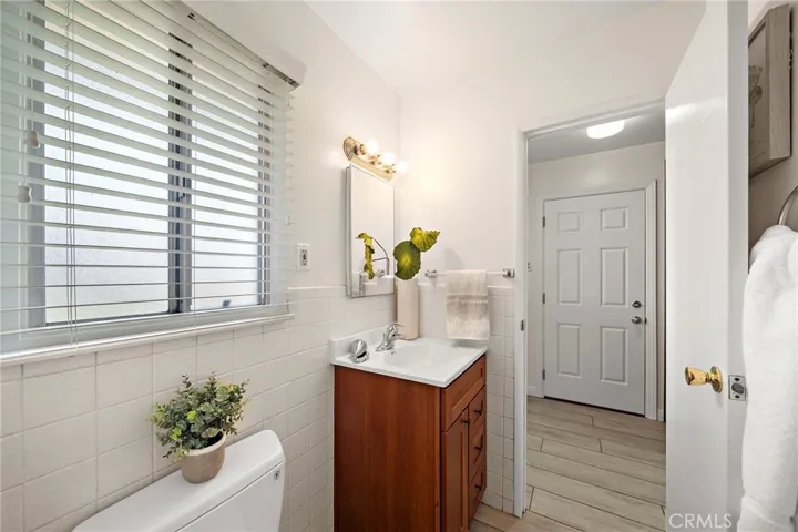 primary bedroom offers a convenient jack-and-jill bath with a tiled walk-in shower