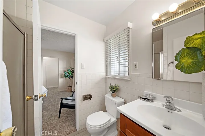 Primary bath offers  tiled walk-in shower