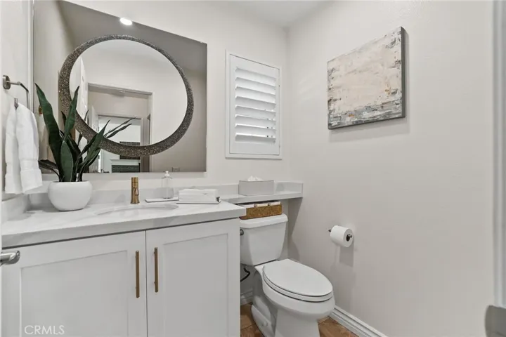 Modern powder room with updated fixtures and elegant finishes.