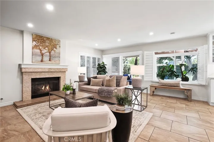 Elegant living room with designer finishes and views of the backyard.
