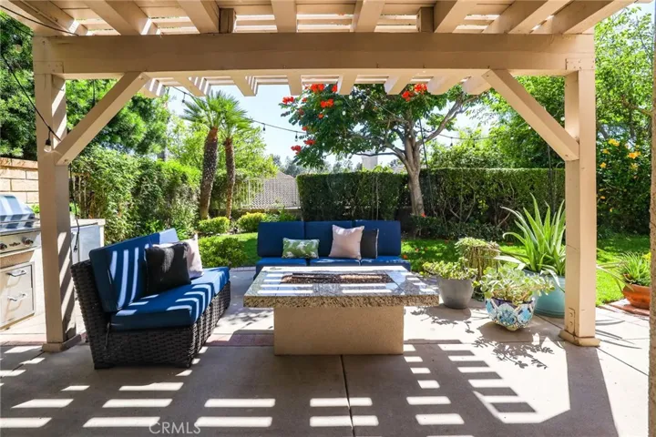 Covered outdoor patio with lounge seating—perfect for relaxing or entertaining.