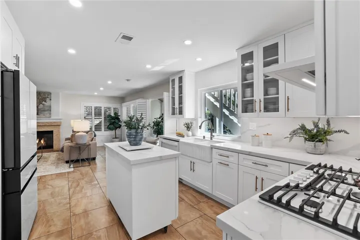 Chef’s kitchen designed for entertaining with high-end appliances and quartz countertops.