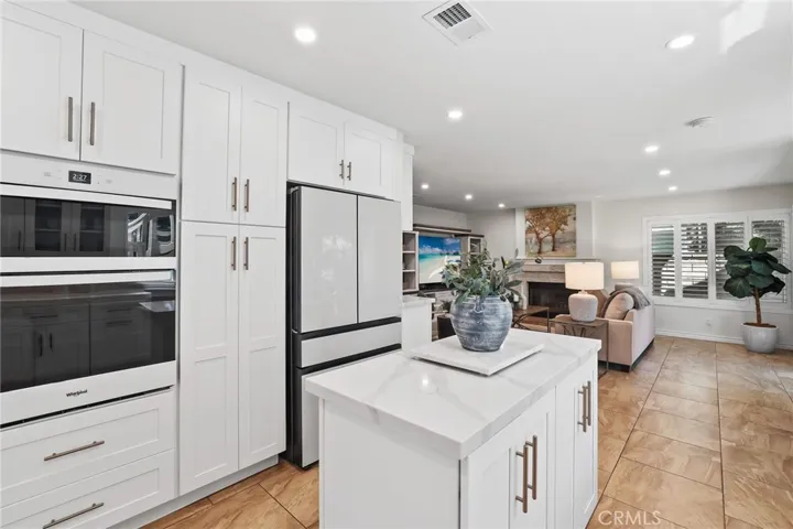 Updated kitchen offering ample storage, sleek finishes, and a seamless flow to living spaces.