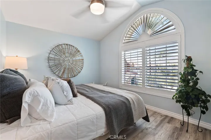 Charming guest bedroom with designer touches and serene ambiance.