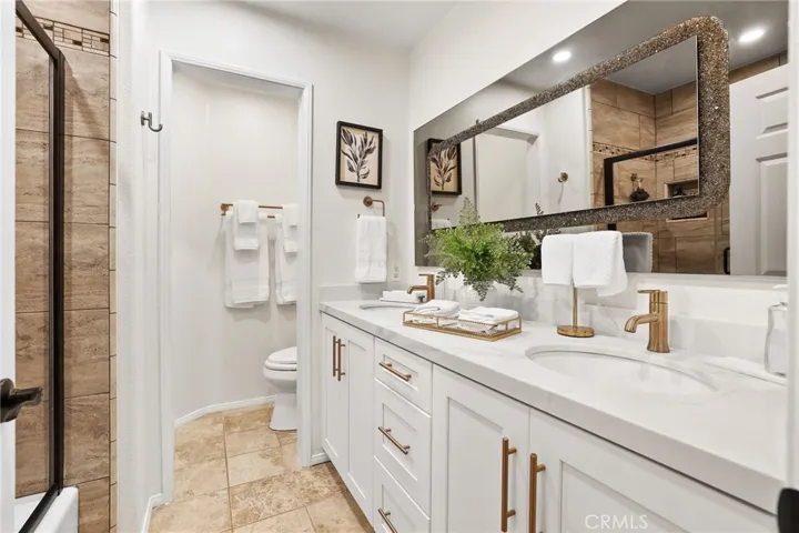 Guest bathroom with stylish design and updated vanity.
