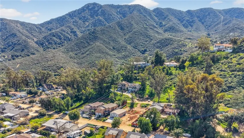 The hills are alive! This home is in such a beautiful setting! It is the one on the right of the 3 homes together close to the center of this photo