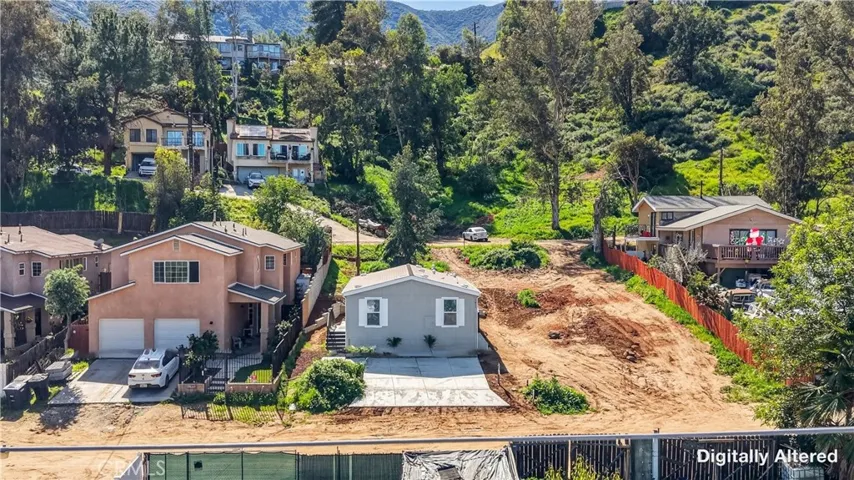 Great place to live! The angle of this photo happened to capture an electric line that is not on the property nor was it above the property. Digitally removed from photo.