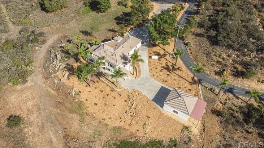 Aerial View showing the main house and the additional 2+ car detached garage/workshop
