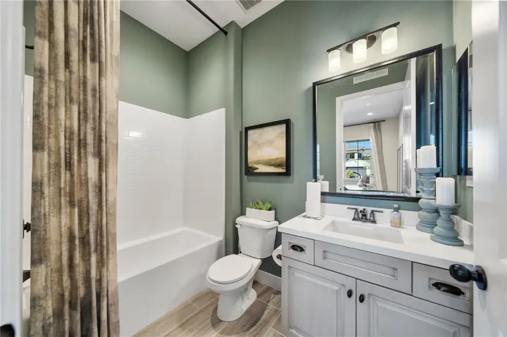 Private bath adjacent to third bedroom.