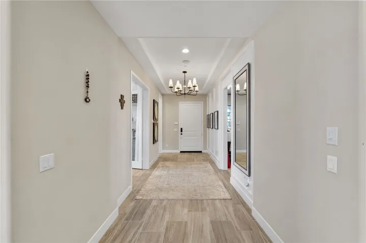Wide hallways greet you with an en-suite bedroom to the left and dedicated office to the right.