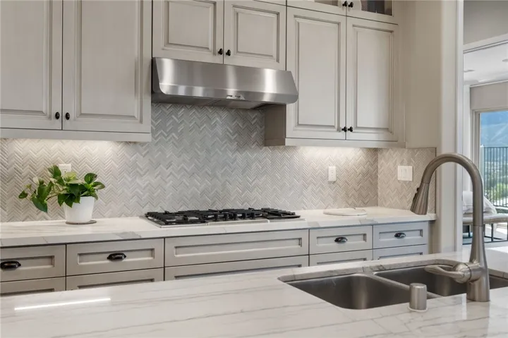 Designer backsplashes enhance the quality cabinetry.