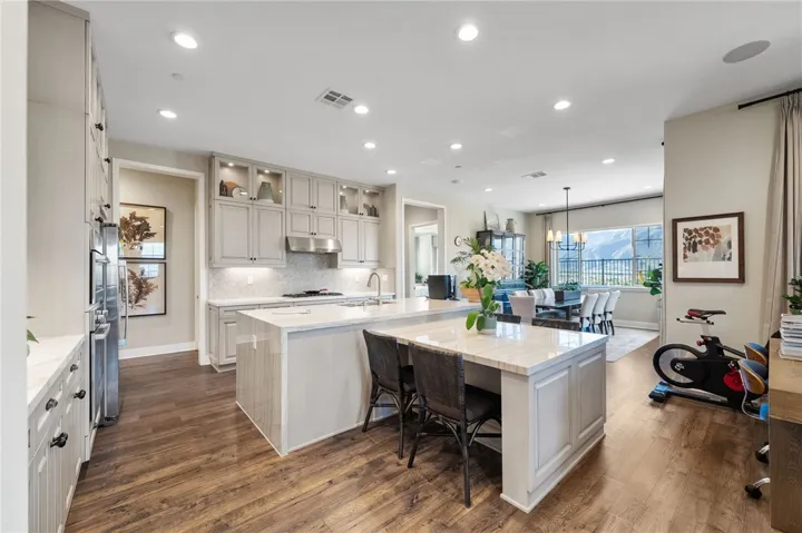 Beautifully upgraded kitchen includes high end cabinetry, Bosch appliances and Quartz countertops.