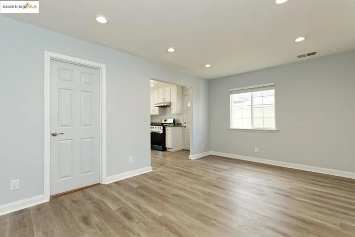 Unfurnished living room featuring light wood finished floors and recessed lighting