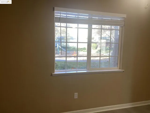 Kitchen room window featuring plenty of natural light abd showing children play area
