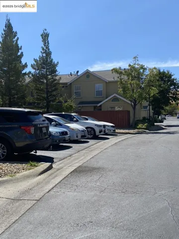 View of front of property featuring a residential view and uncovered parking