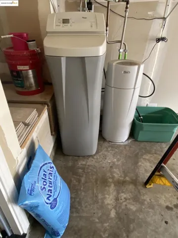 water softner located in the garage ( needs salt)