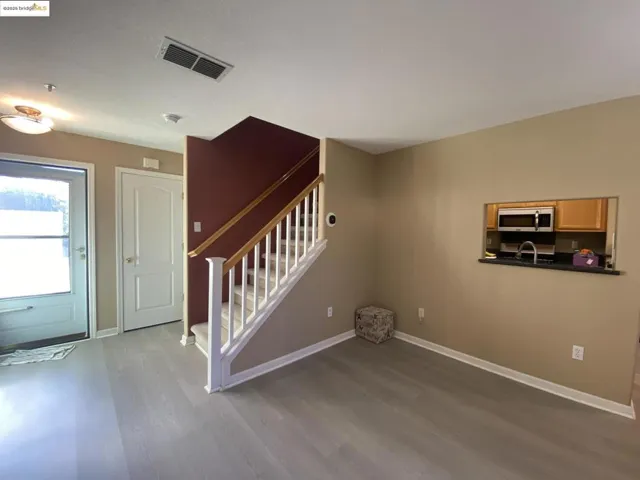 Entryway with stairs and light wood-style flooring