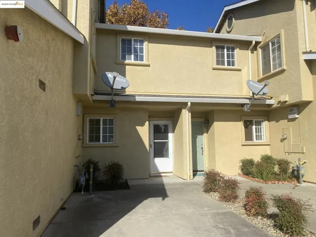 Entrance to property with stucco siding