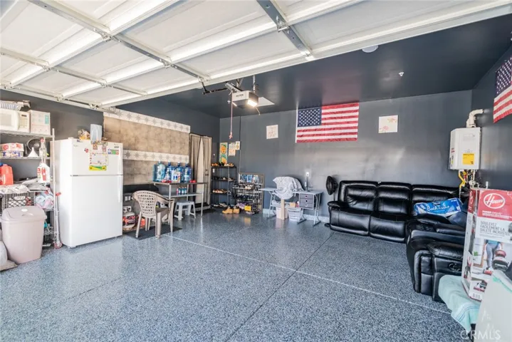 2 car garage with epoxy flooring and tankless water heater