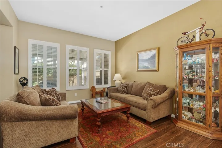 The formal living room. Notice the wood shutters on the windows.