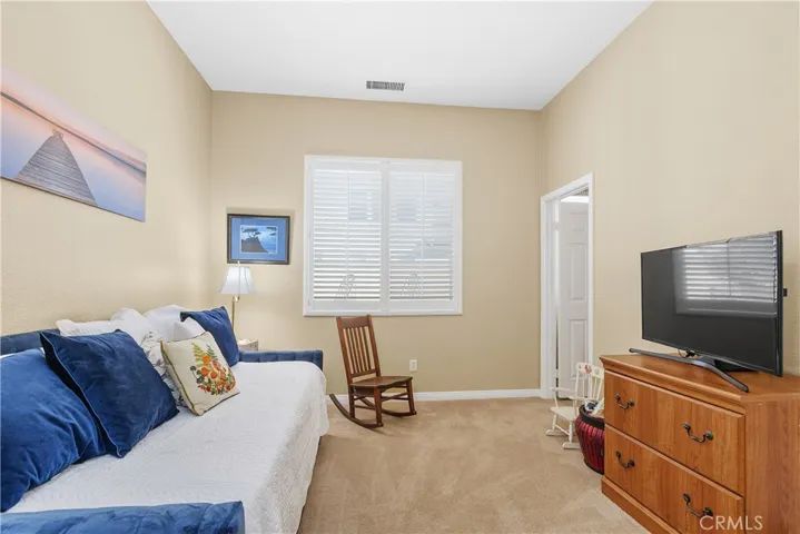 The Guest Suite bedroom is to the right as you enter the home. This room has an ensuite bathroom and a large closet.
