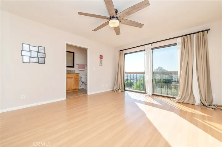 1st BR (Primary BR suite)- balcony, mirrored Closet door