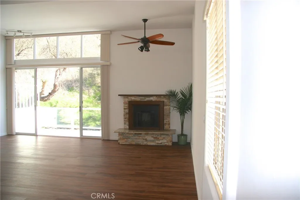 Spacious living room with fireplace and view. Picture prior tenant