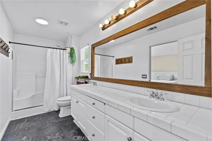 Primary Bathroom with Dual Sinks and Spacious Shower