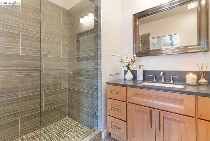Bathroom with vanity and a stall shower