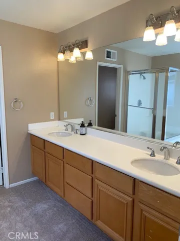 Dual vanities, soaking tub and step in shower.