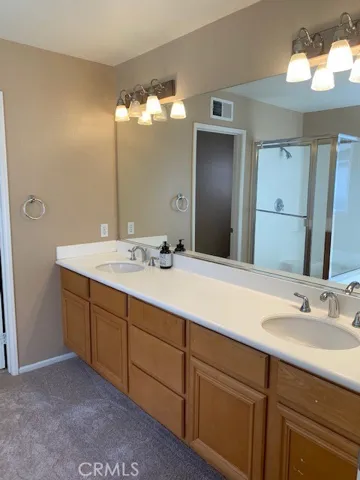 Dual vanities, soaking tub and step in shower.