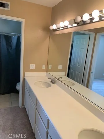 This bath opens to both secondary bedrooms and boasts dual vanities.