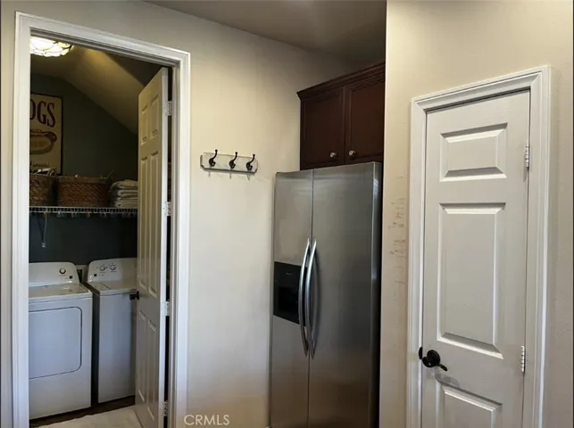 Laundry room between kitchen and garage