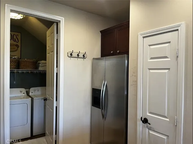 Laundry room between kitchen and garage