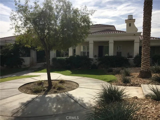 view of back patio from greenbelt
