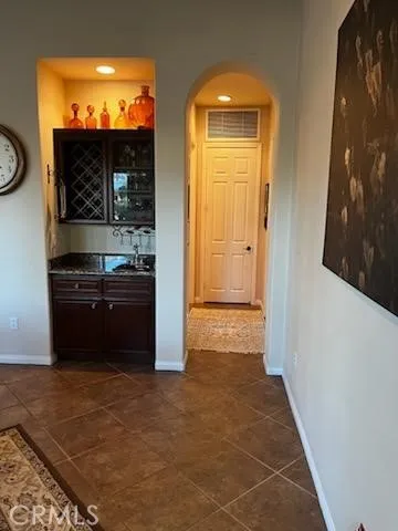 Wet Bar and hall to 1/2 bath and MBR