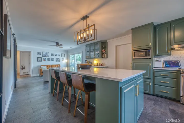 Kitchen with center island bar seating