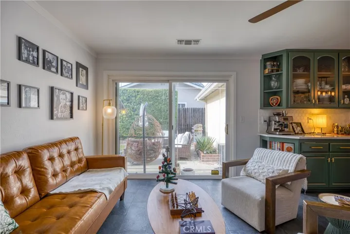 Sliding glass doors lead to the back yard and patio