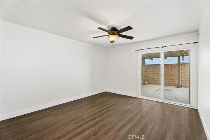 Primary bedroom with a slider out to the private patio.