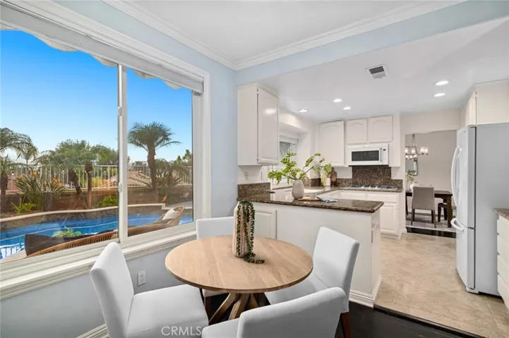 The kitchen flows into the formal dining room and seperate dining area