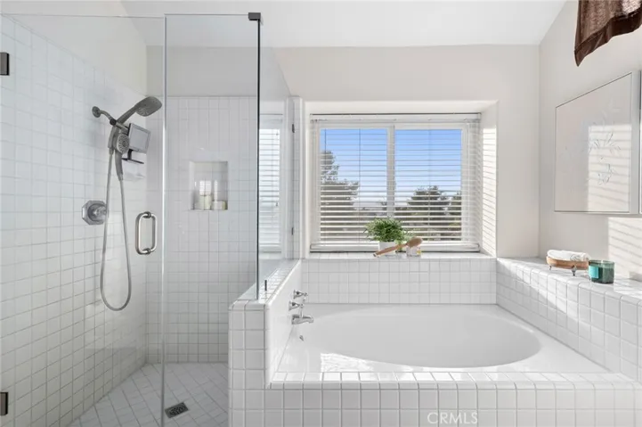 Ensuite primary bathroom with seperate tub