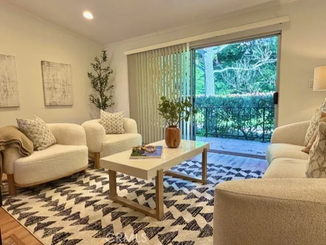 Living Room looks out to private patio and lush green surroundings