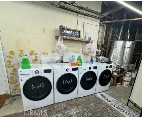 Double Washer/Dryer shared in Garage