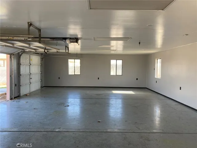 Garage interior looking east, door open
