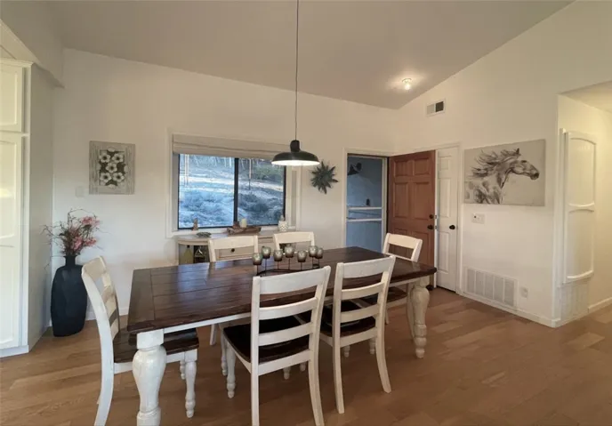 Comfortable dining area connecting the kitchen and living room.