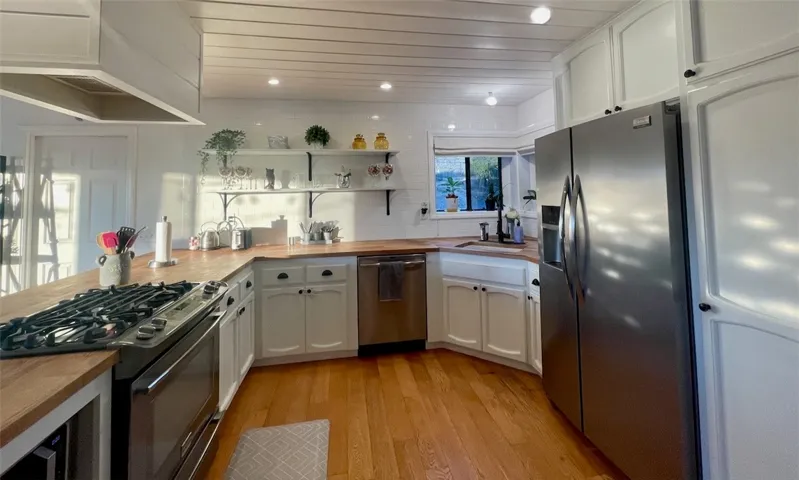 Natural light fills the kitchen, creating a warm and inviting space to cook and gather.