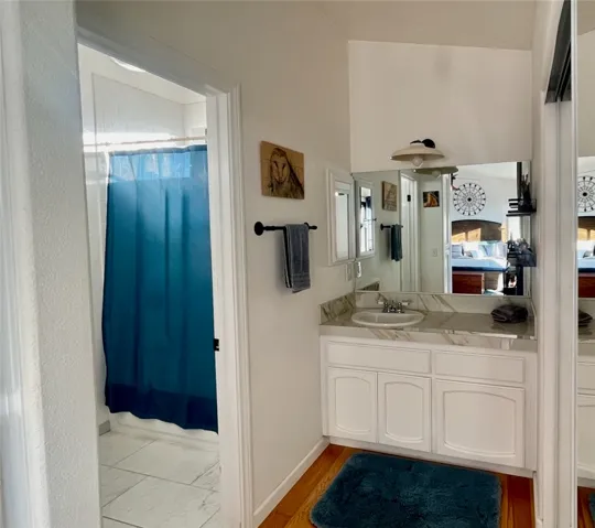 En-suite bath with generous storage.