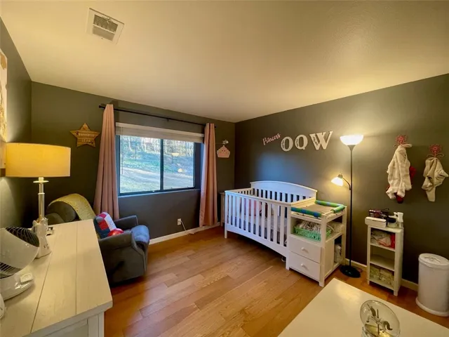 Flexible bedroom space ideal for a nursery, guest room, or home office.